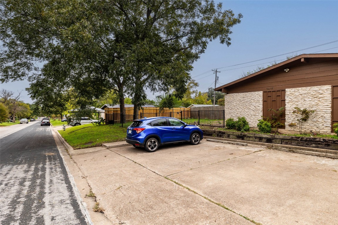 1411 Braes Ridge Drive, Unit B Austin, TX 78723 - Photo 7 of 37 a view of a car parked in front of a house