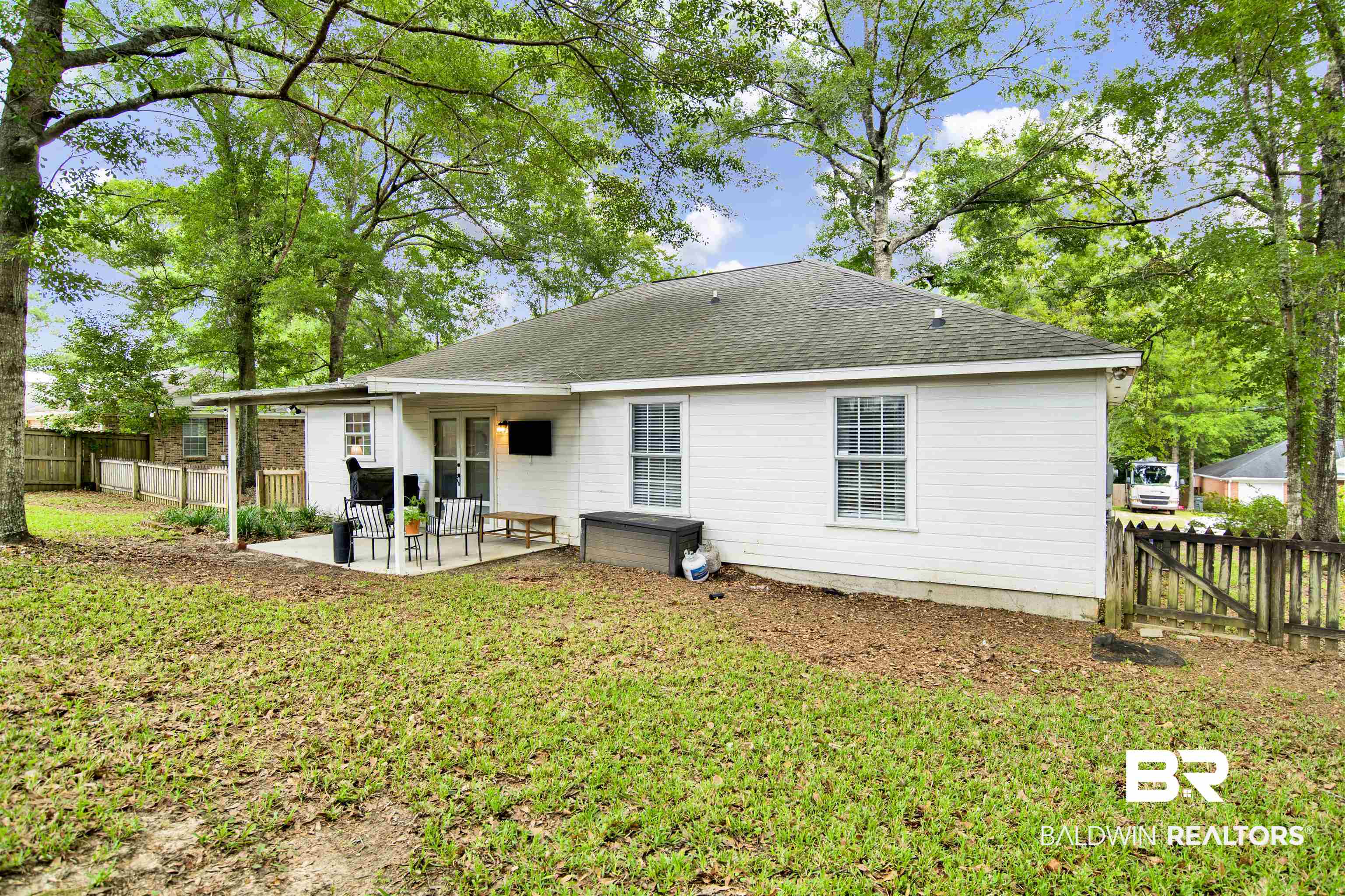 142 Richmond Road Daphne, AL 36526 - Photo 25 of 27 Rear view of property featuring a patio area and a shingled roof