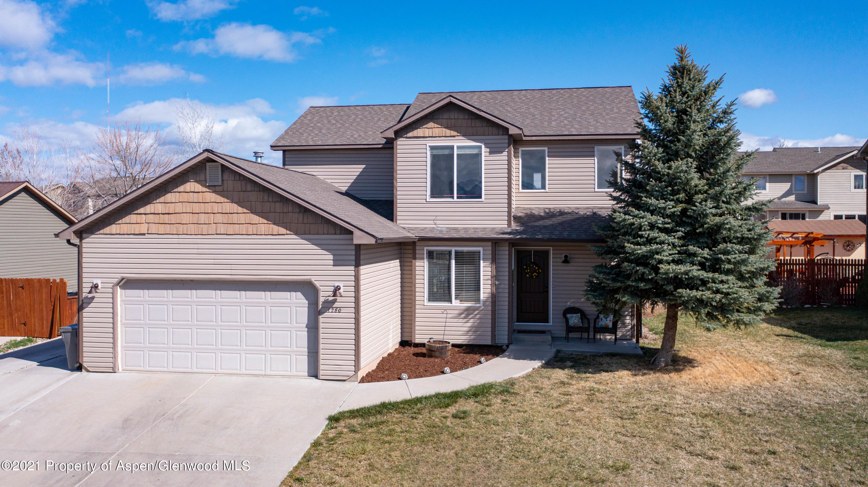 1280 East 18th Way Rifle, CO 81650 - Photo 1 of 18 a front view of a house with a yard