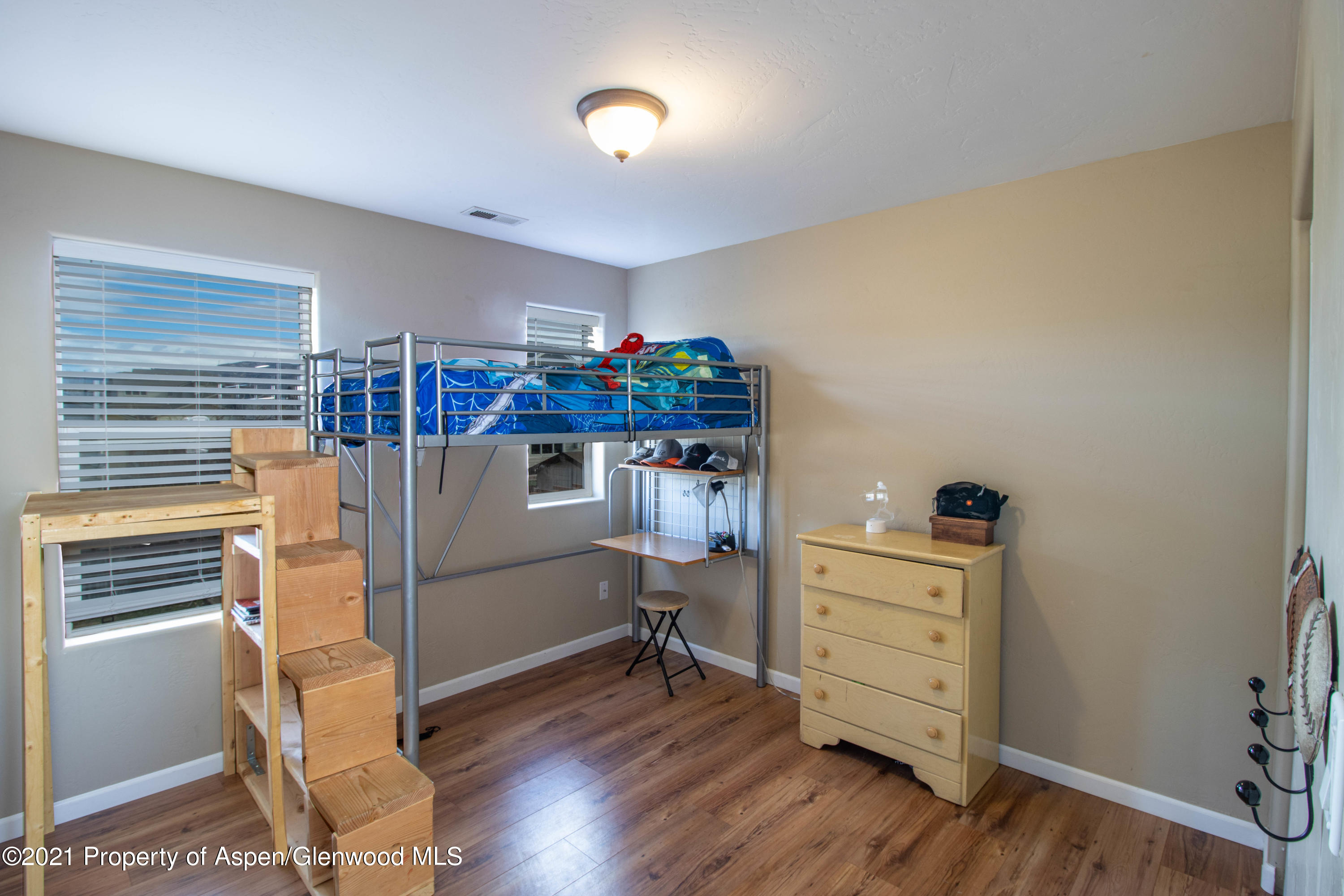 1280 East 18th Way Rifle, CO 81650 - Photo 11 of 18 a room with furniture and a wooden floor