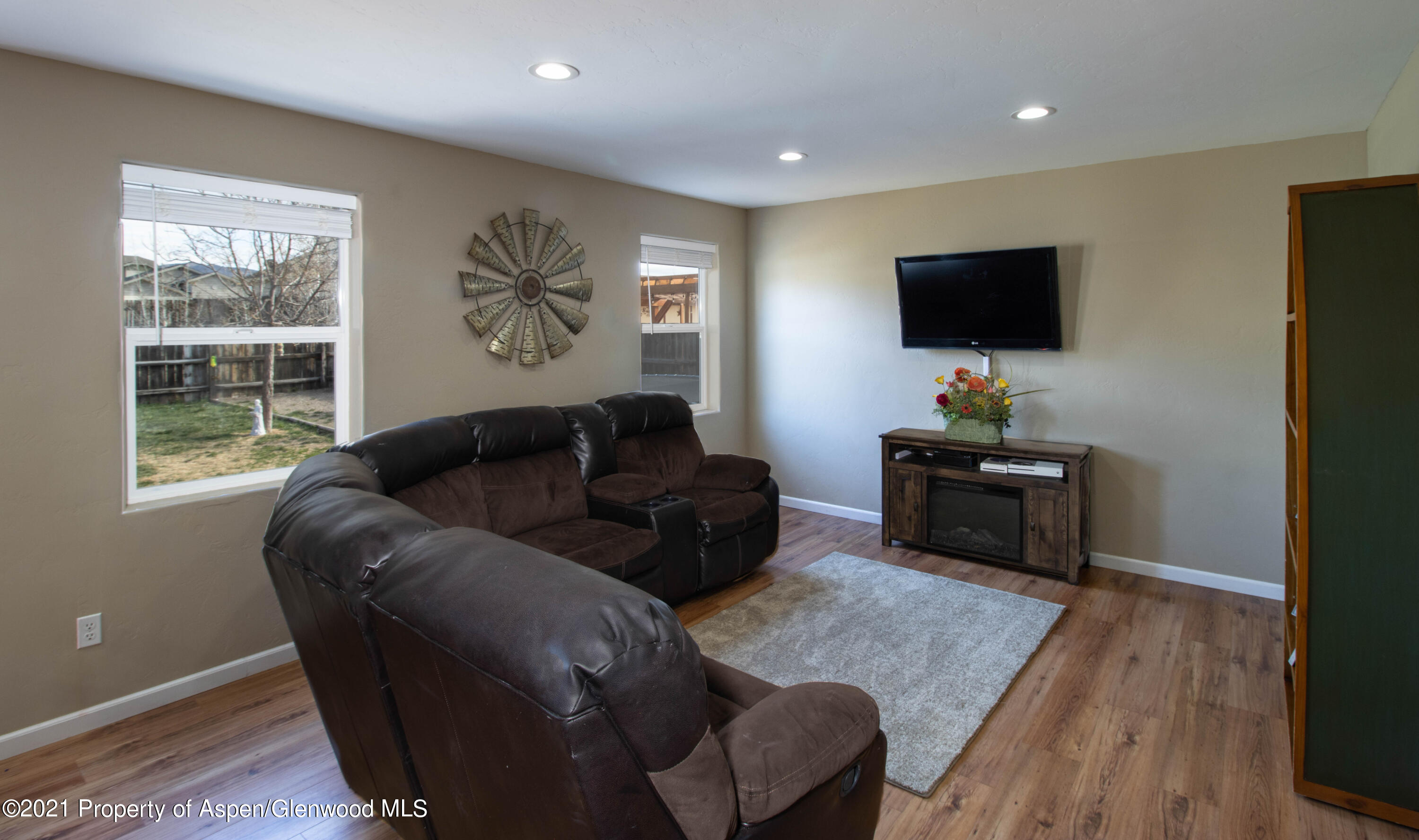 1280 East 18th Way Rifle, CO 81650 - Photo 5 of 18 a living room with furniture and a flat screen tv