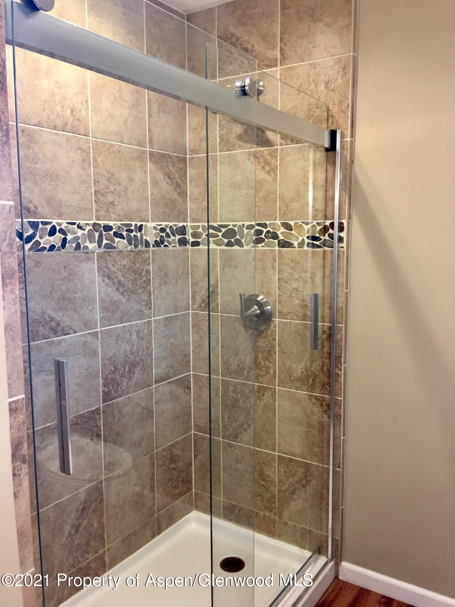 1280 East 18th Way Rifle, CO 81650 - Photo 10 of 18 a bathroom with a shower