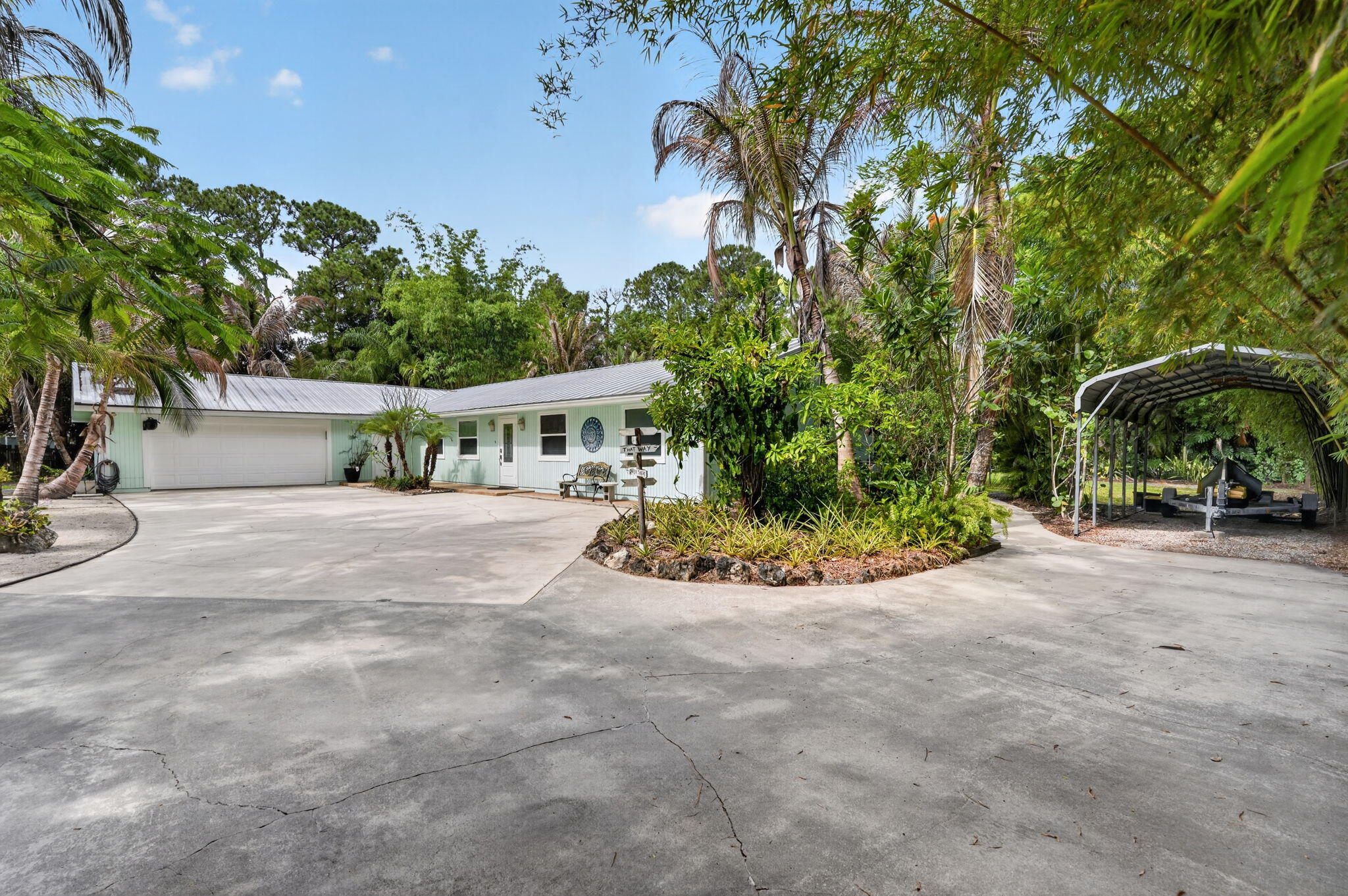 17391 Alexander Run Jupiter, FL 33478 - Photo 2 of 55 a view of house with outdoor space and swimming pool