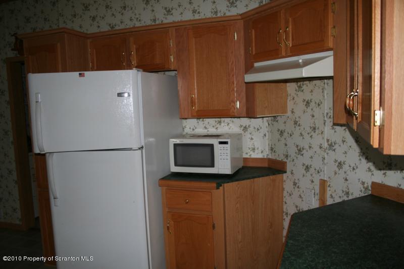 351 R Casterline Road Dallas, PA 18612 - Photo 12 of 13 a white refrigerator freezer sitting in a kitchen