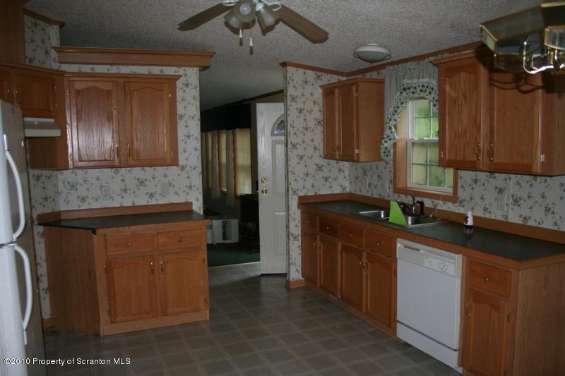 351 R Casterline Road Dallas, PA 18612 - Photo 5 of 13 a kitchen with stainless steel appliances granite countertop a sink and a refrigerator