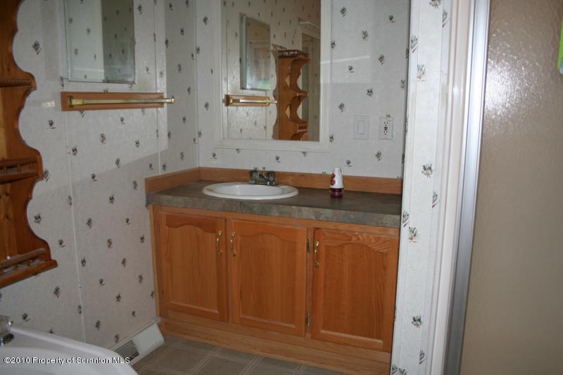 351 R Casterline Road Dallas, PA 18612 - Photo 9 of 13 a bathroom with a granite countertop sink and a mirror