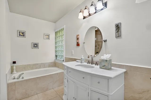 a bathroom with a bathtub and shower