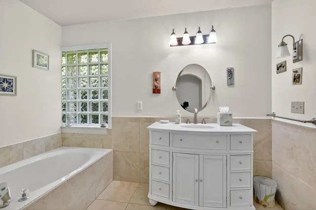 a bathroom with a glass shower door