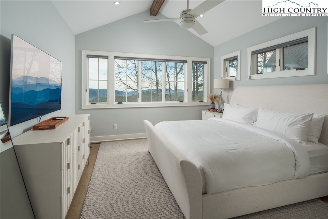 227 Calico Court Boone, NC 28607 - Photo 21 of 47 a room with a bed and a flat screen tv