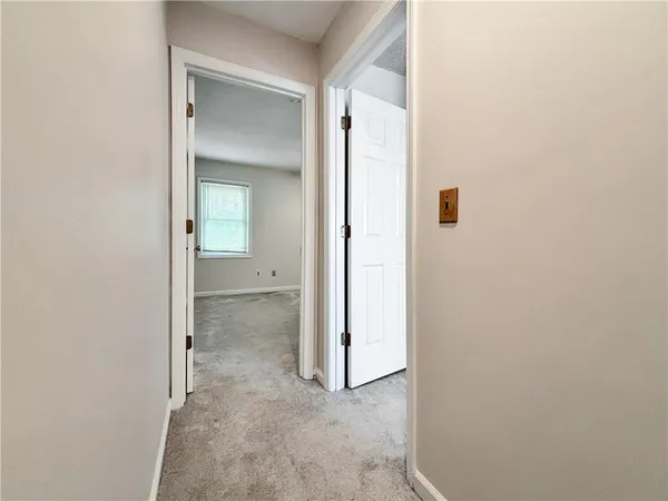 a view of a bathroom from a hallway