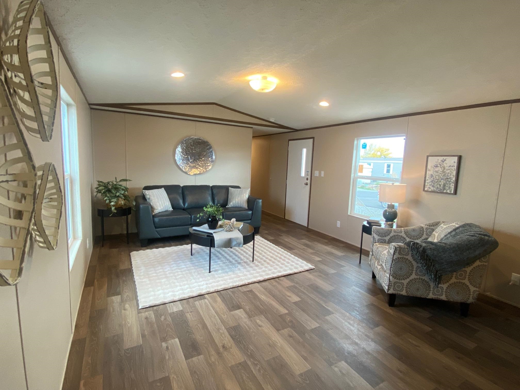 9969 Kremmling Road Austin, CO 81410 - Photo 3 of 15 a living room with furniture and a wooden floor