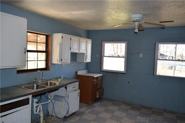 847 Frontier Road Altamont, TN 37301 - Photo 3 of 8 14x20 Kitchen with white cabinetry.