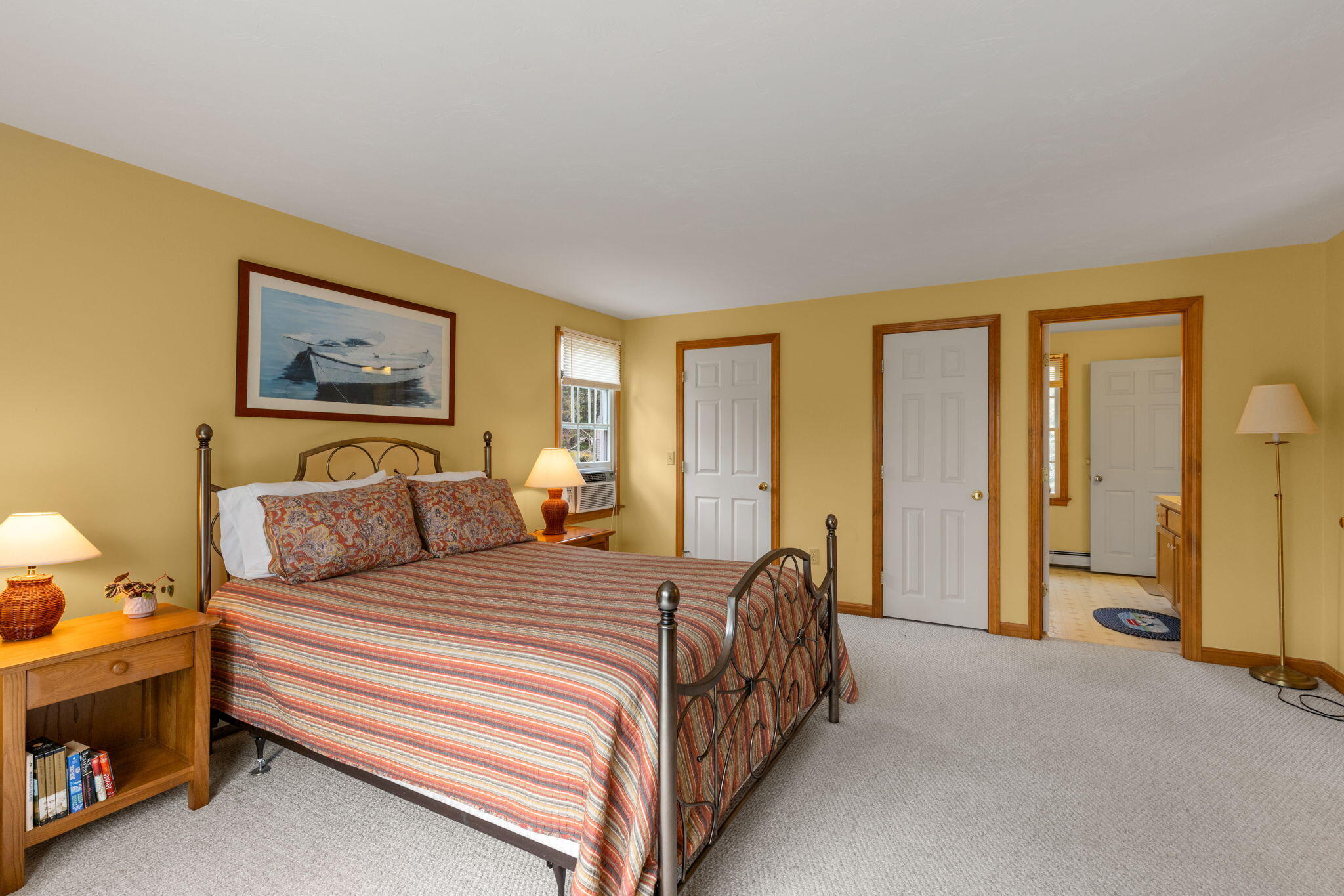 285 Blue Heron Road Wellfleet, MA 02667 - Photo 18 of 31 a bedroom with a bed and a painting on the wall