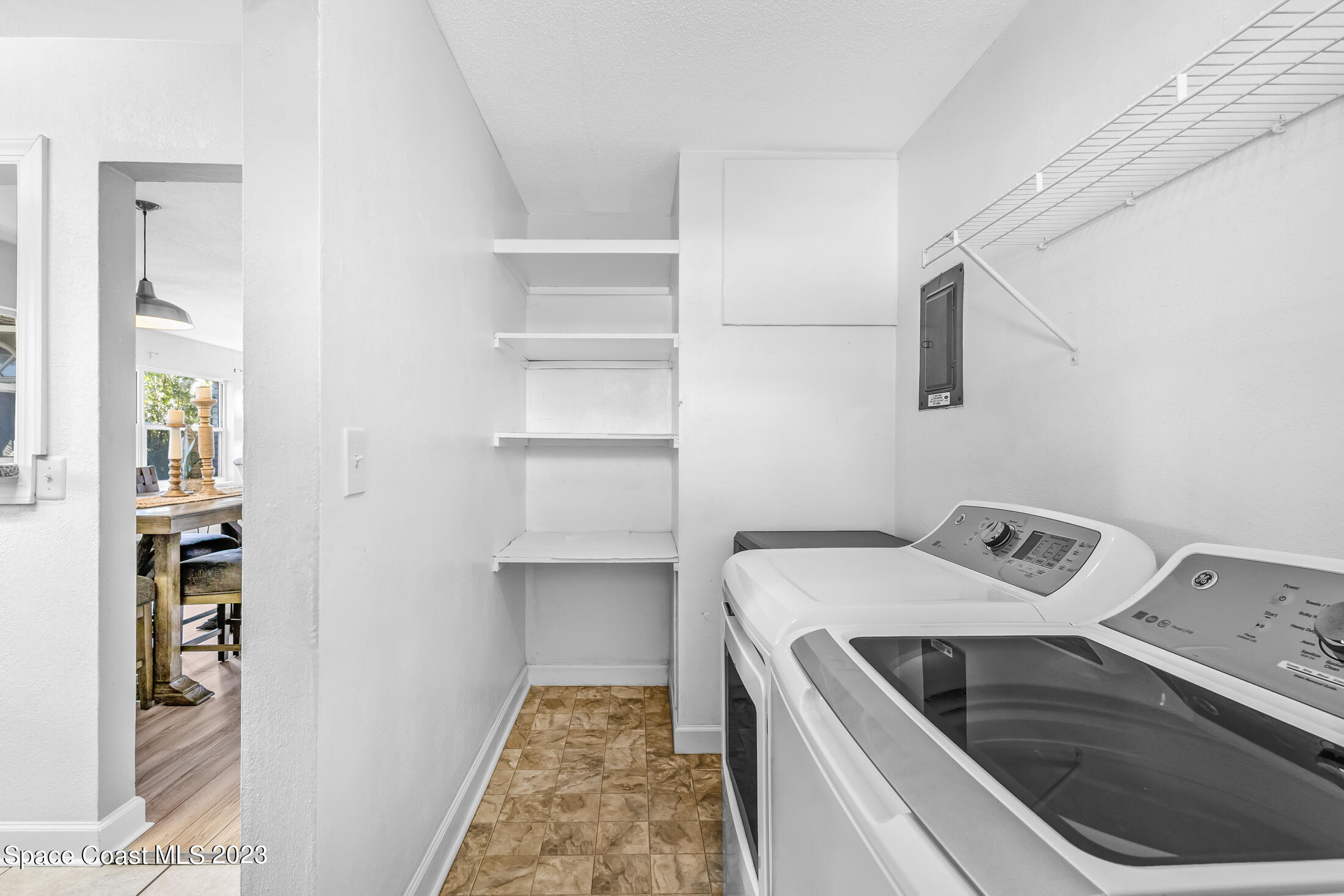 696 Teak Drive Melbourne, FL 32935 - Photo 18 of 22 a utility room with washer and dryer