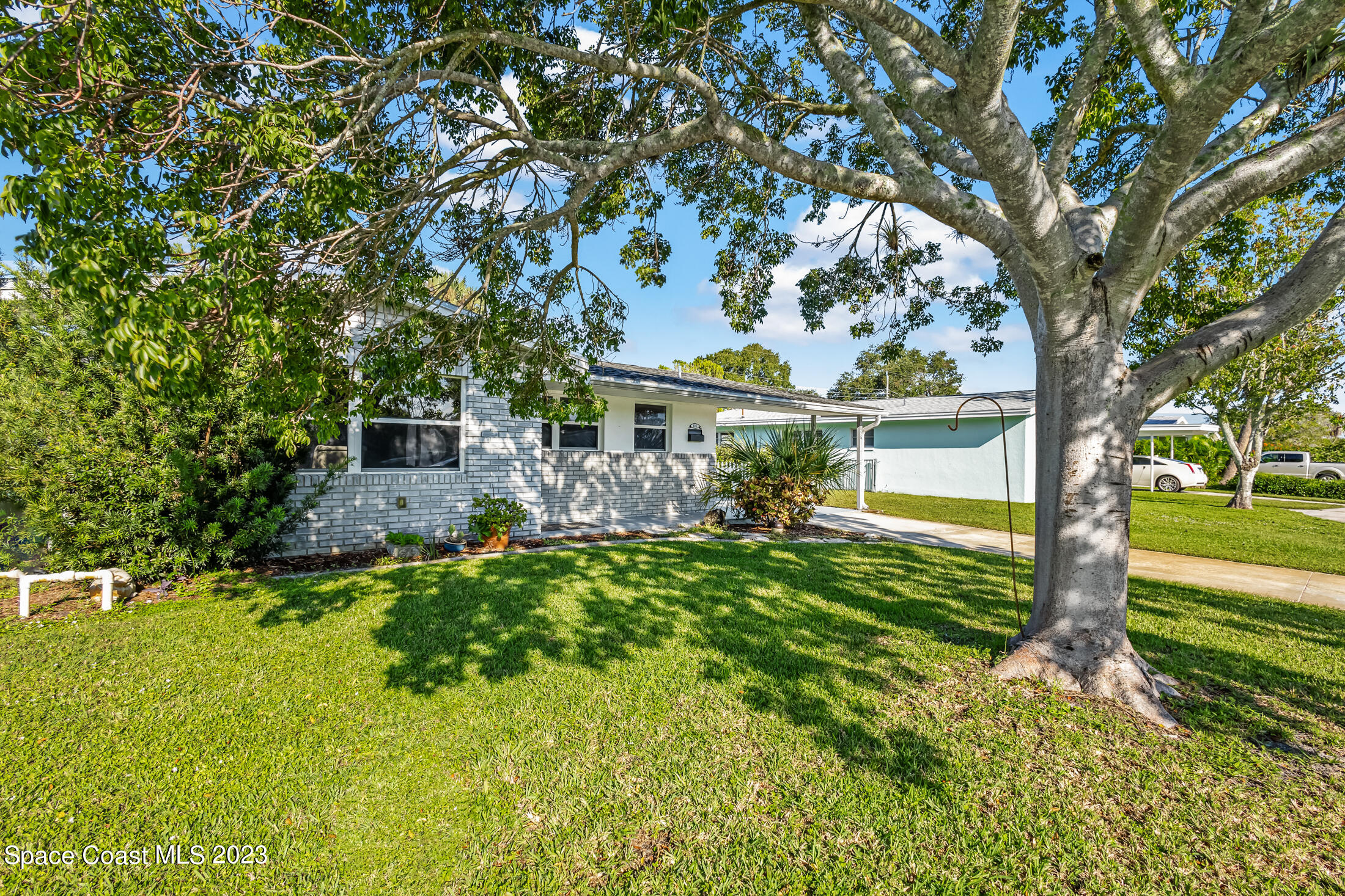 696 Teak Drive Melbourne, FL 32935 - Photo 4 of 22 a front view of a house with garden