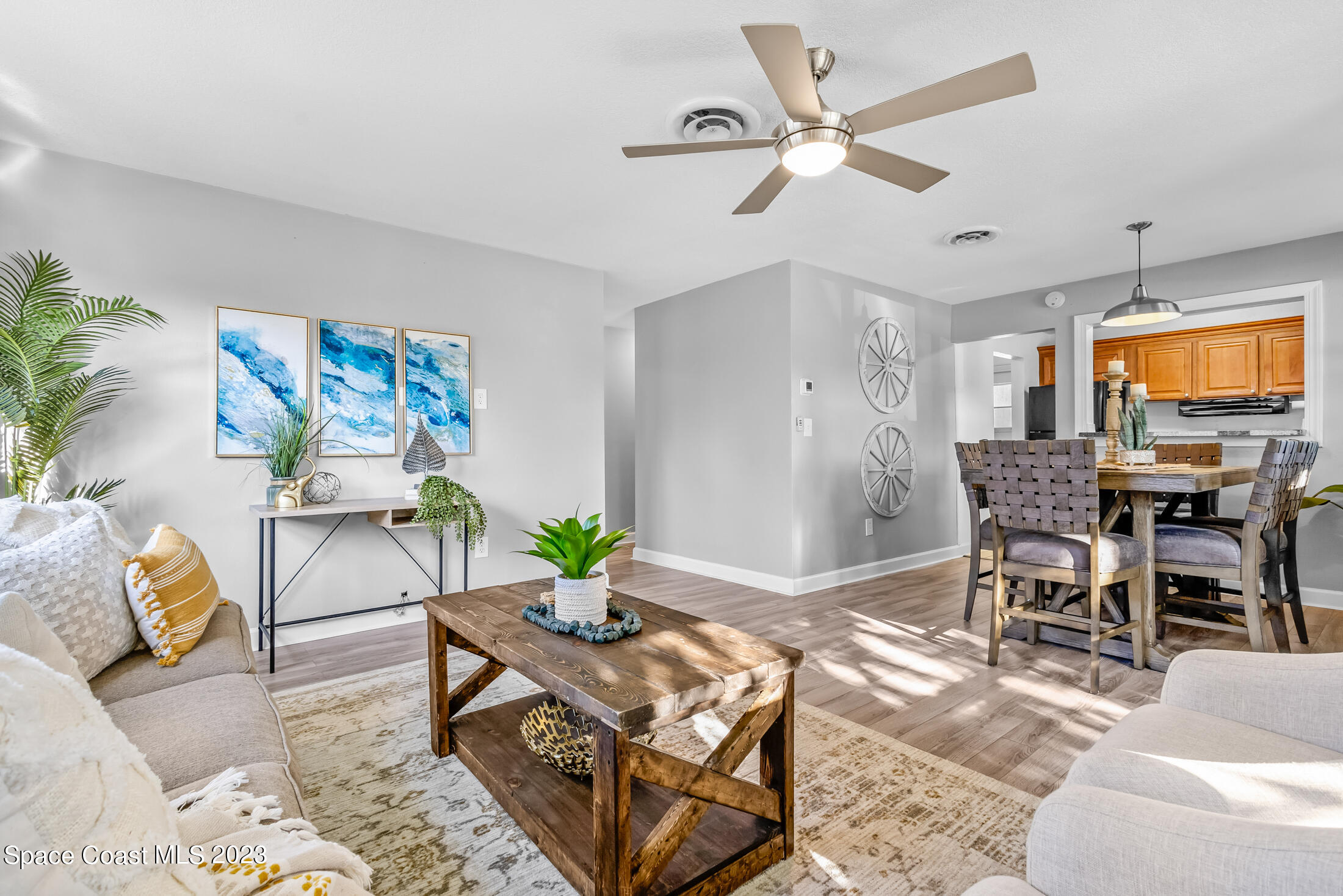 696 Teak Drive Melbourne, FL 32935 - Photo 7 of 22 a living room with furniture and wooden floor