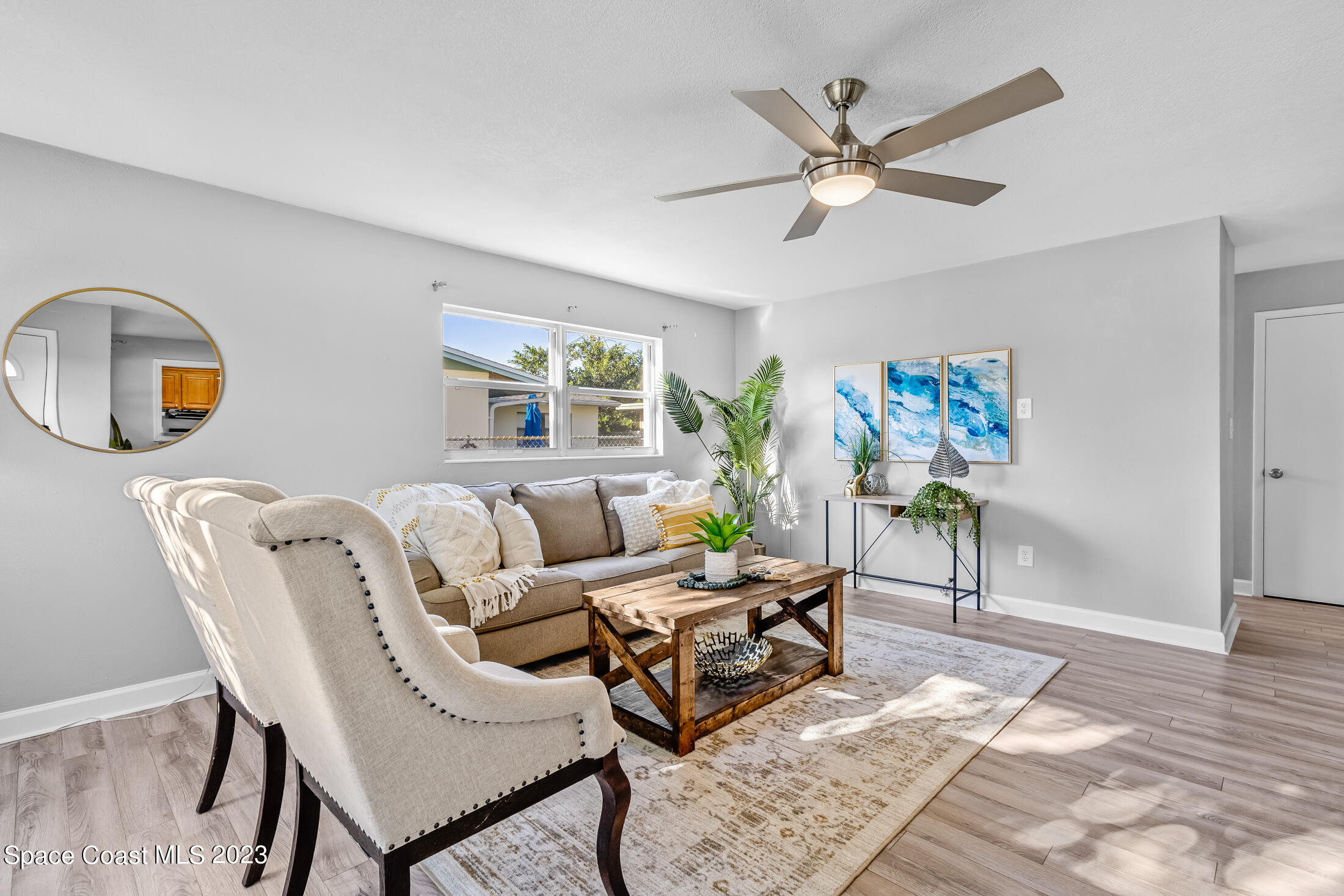 696 Teak Drive Melbourne, FL 32935 - Photo 9 of 22 a living room with furniture and a window