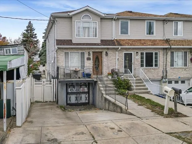 a front view of a house with a garage