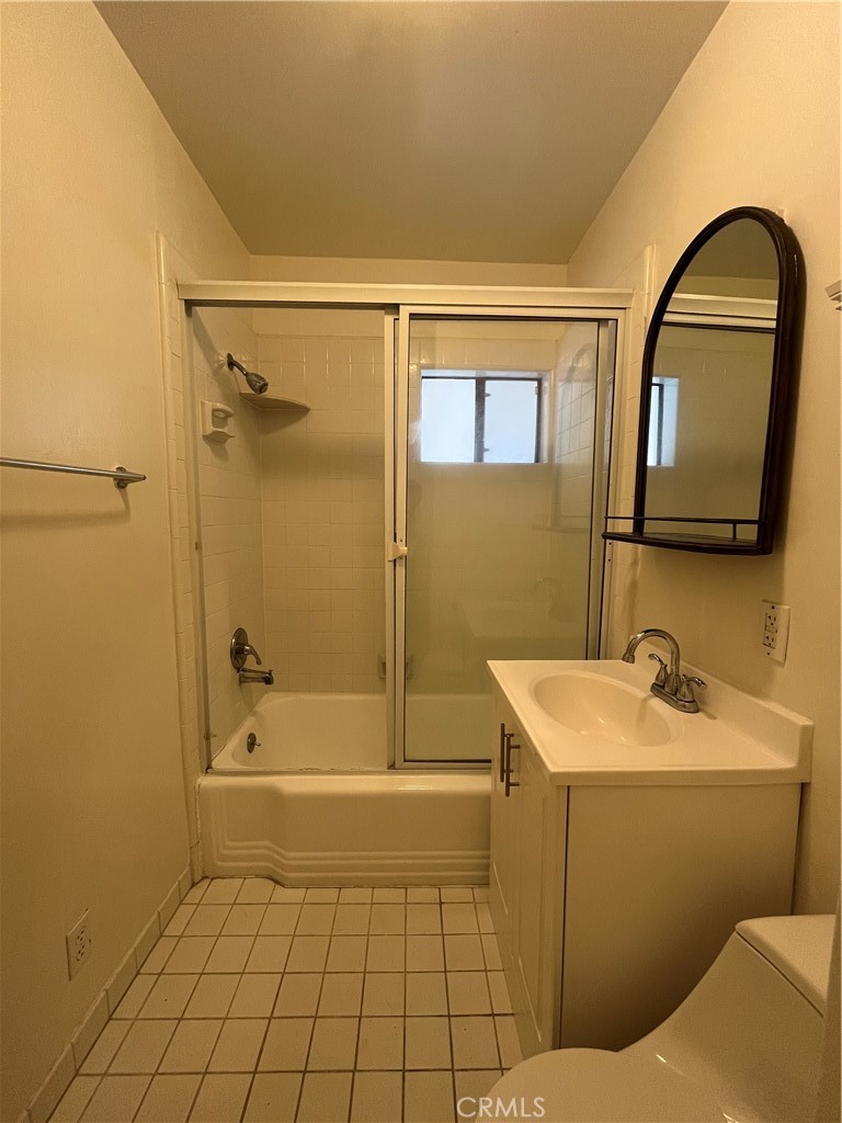 18029 Santa Rita Street Encino, CA 91316 - Photo 8 of 20 a bathroom with a sink a toilet and shower