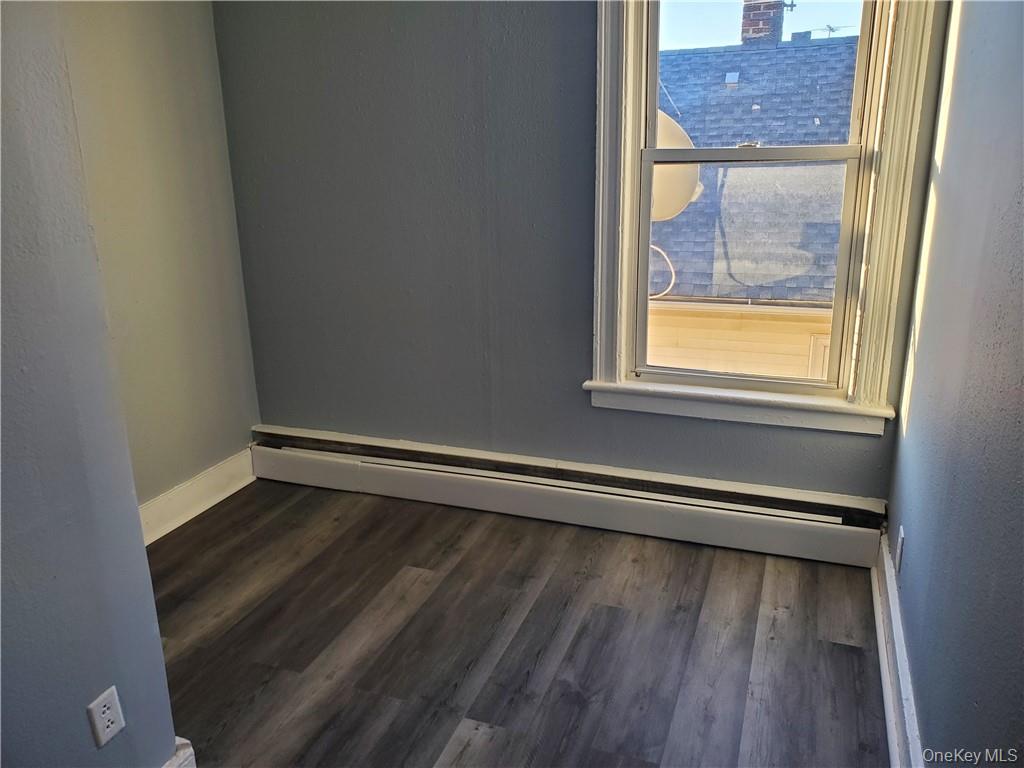76 State Street, Unit 10 Ossining, NY 10562 - Photo 12 of 23 a view of a small space with wooden floor and a window