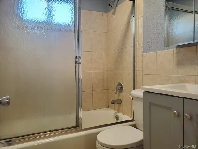a bathroom with a toilet and shower