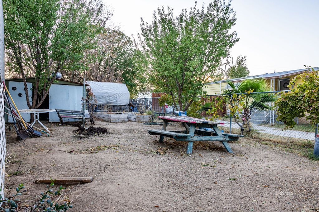 5234 Cholla Way Ridgecrest, CA 93555 - Photo 33 of 39 a view of a backyard with sitting area