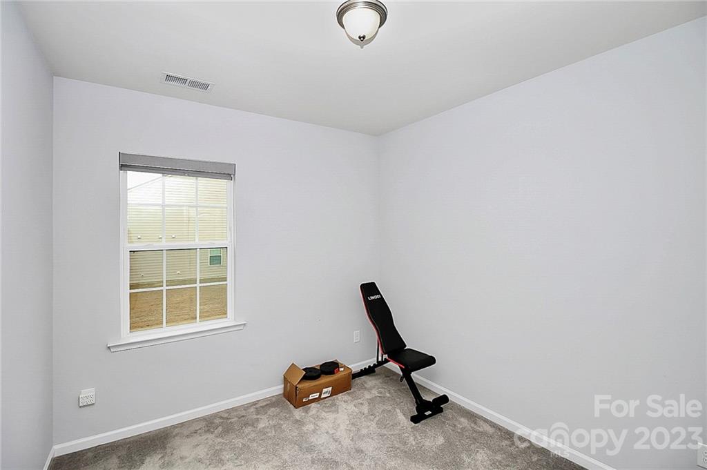 227 Houston Blair Road Matthews, NC 28104 - Photo 11 of 39 a view of a workspace with furniture and a window