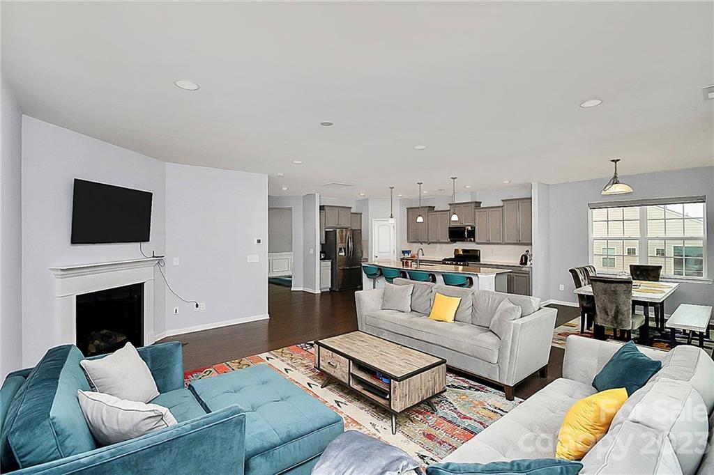 227 Houston Blair Road Matthews, NC 28104 - Photo 20 of 39 a living room with furniture and a flat screen tv