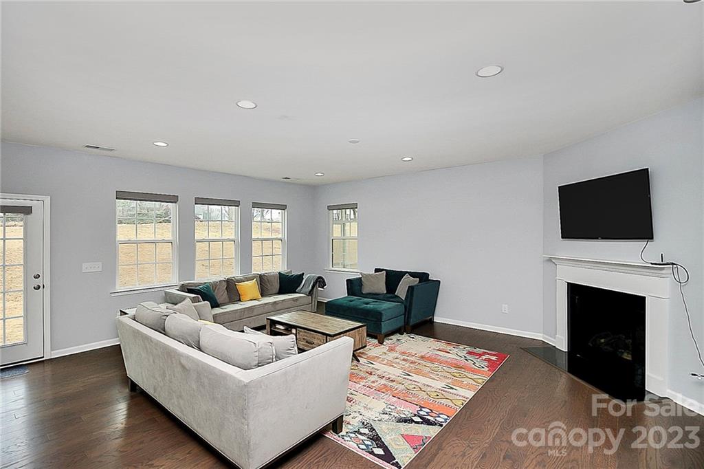 227 Houston Blair Road Matthews, NC 28104 - Photo 22 of 39 a living room with furniture and a flat screen tv