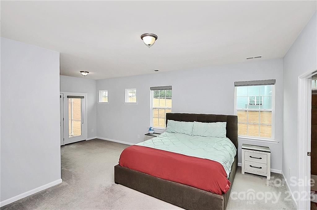 227 Houston Blair Road Matthews, NC 28104 - Photo 23 of 39 a bedroom with a bed and window
