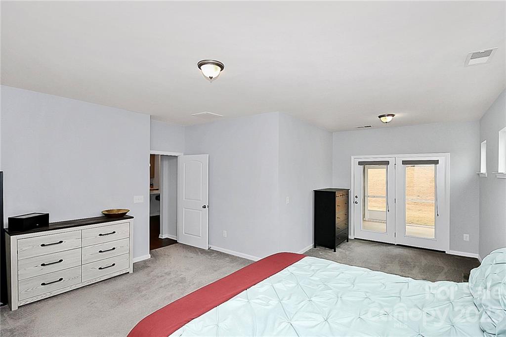 227 Houston Blair Road Matthews, NC 28104 - Photo 24 of 39 a bedroom with a bed and a dresser