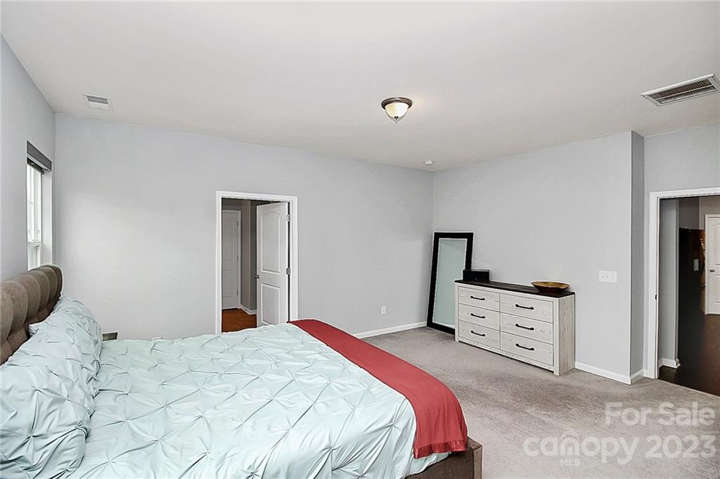 227 Houston Blair Road Matthews, NC 28104 - Photo 25 of 39 a bedroom with a bed and a dresser