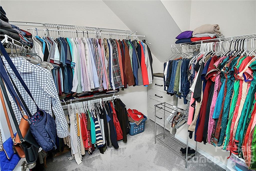 227 Houston Blair Road Matthews, NC 28104 - Photo 26 of 39 a view of walk in closet with clothes and shoes