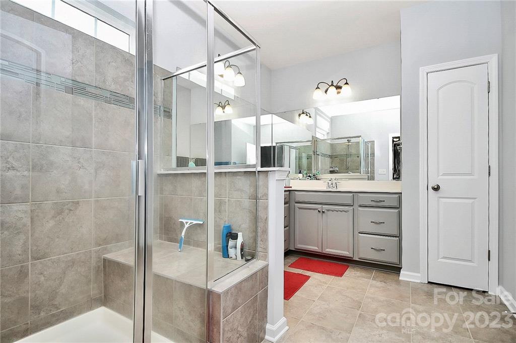 227 Houston Blair Road Matthews, NC 28104 - Photo 28 of 39 a bathroom with a sink double vanity and a mirror