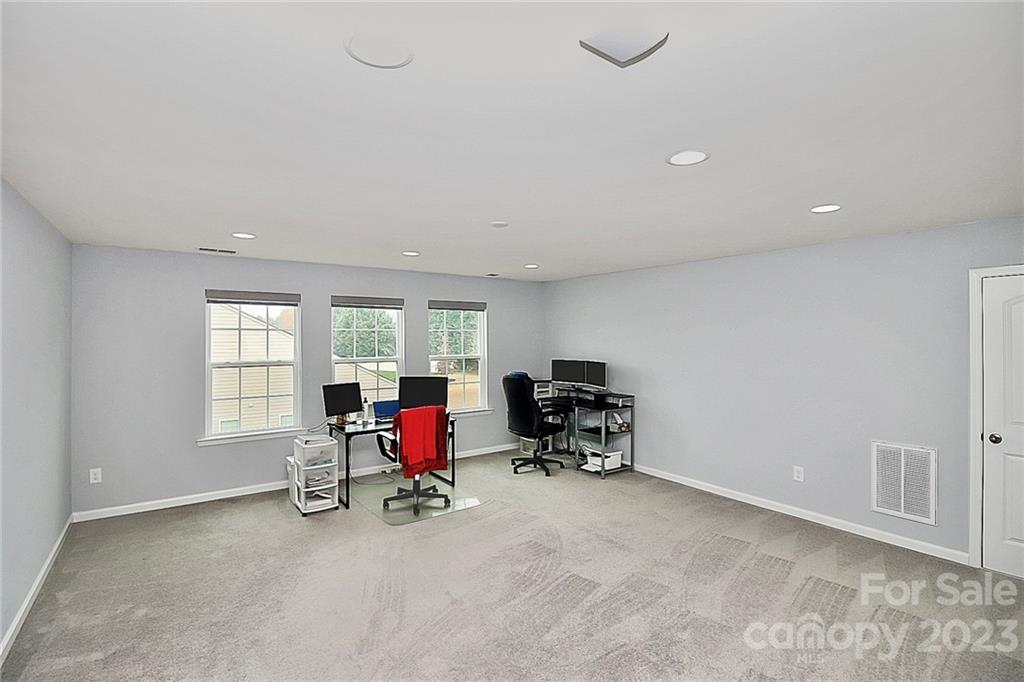 227 Houston Blair Road Matthews, NC 28104 - Photo 31 of 39 a view of a livingroom with lounge chair and a window