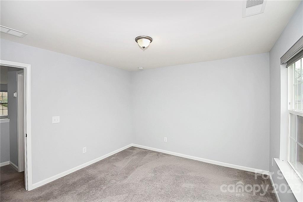 227 Houston Blair Road Matthews, NC 28104 - Photo 34 of 39 an empty room with a window