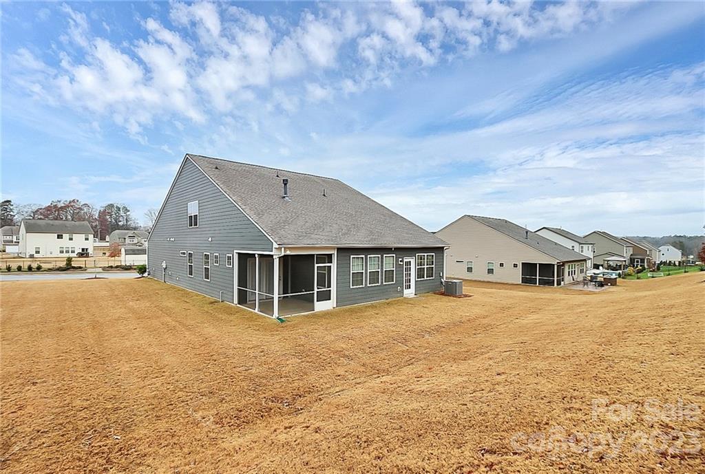 227 Houston Blair Road Matthews, NC 28104 - Photo 35 of 39 a view of a large house with a big yard and large trees