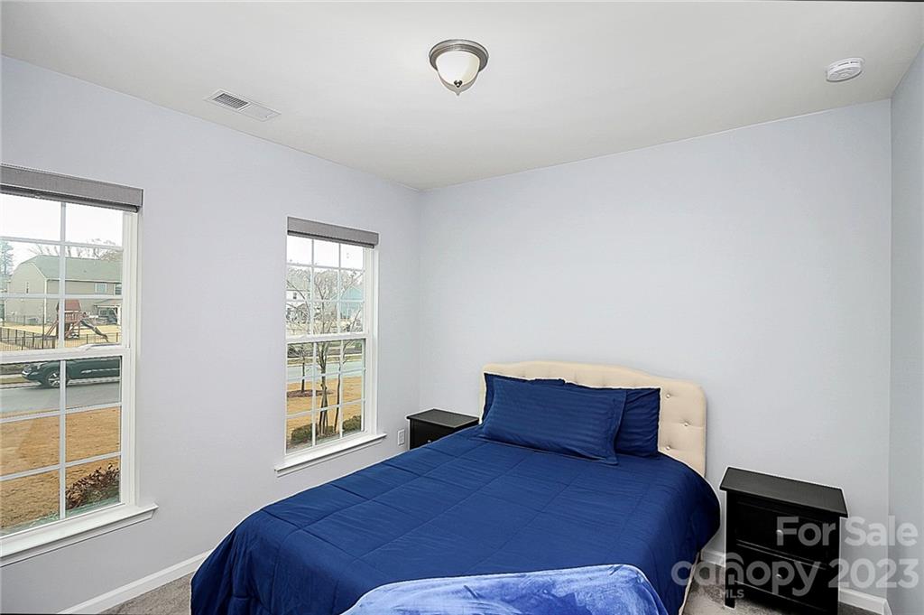 227 Houston Blair Road Matthews, NC 28104 - Photo 9 of 39 a bedroom with a bed and a window