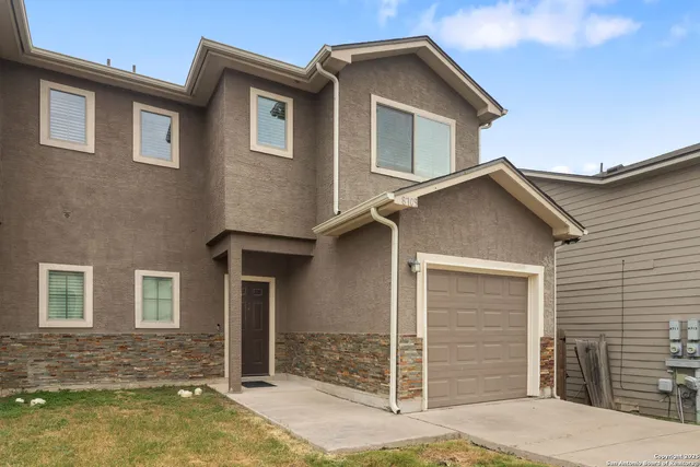 a front view of a house with glass windows