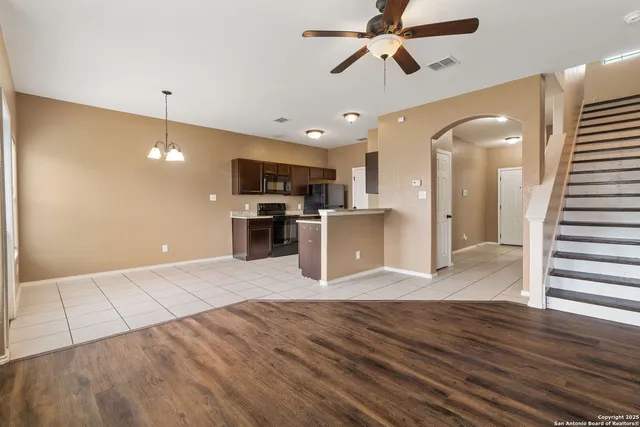 a view of a kitchen with a sink and a microwave