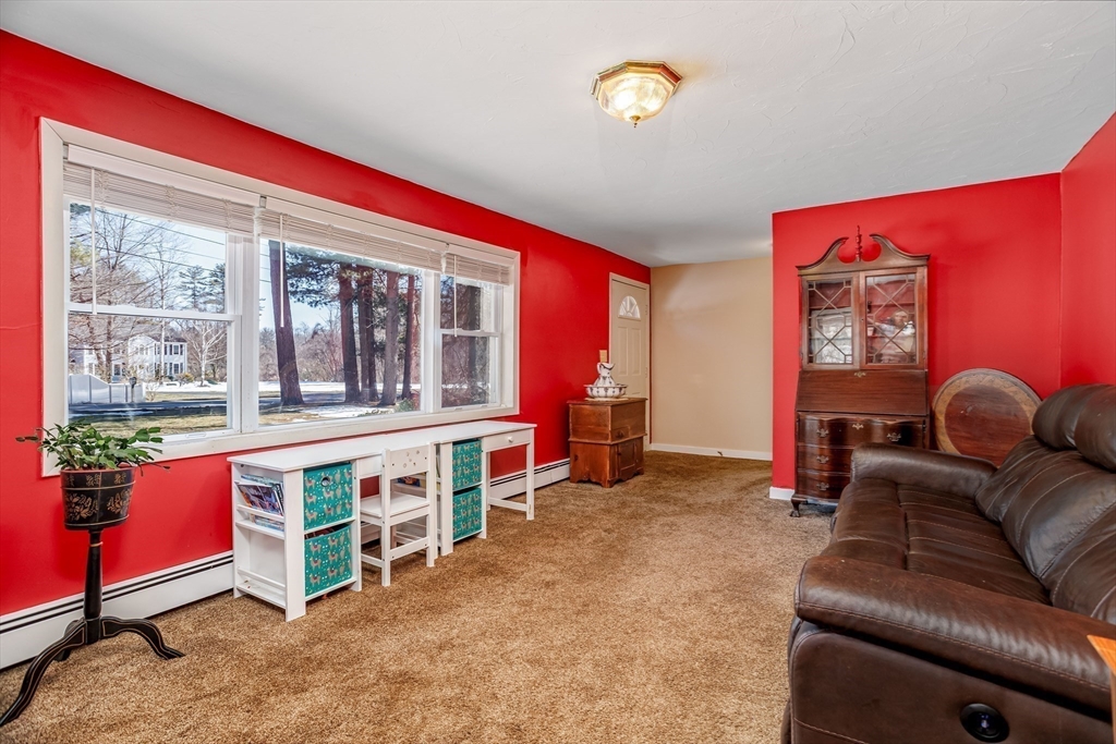 113 Parker Road, Unit 1 Lancaster, MA 01523 - Photo 14 of 30 a living room with furniture and a large window