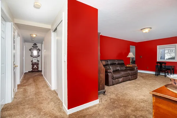 a view of a livingroom with furniture and a flat screen tv