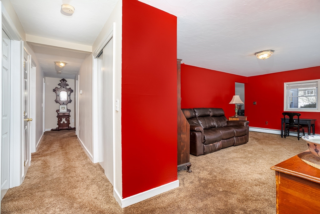 113 Parker Road, Unit 1 Lancaster, MA 01523 - Photo 15 of 30 a view of a livingroom with furniture and a flat screen tv
