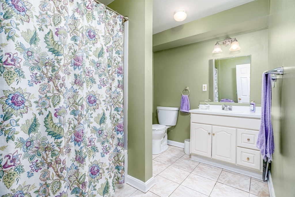 113 Parker Road, Unit 1 Lancaster, MA 01523 - Photo 23 of 30 a spacious bathroom with a sink toilet and shower