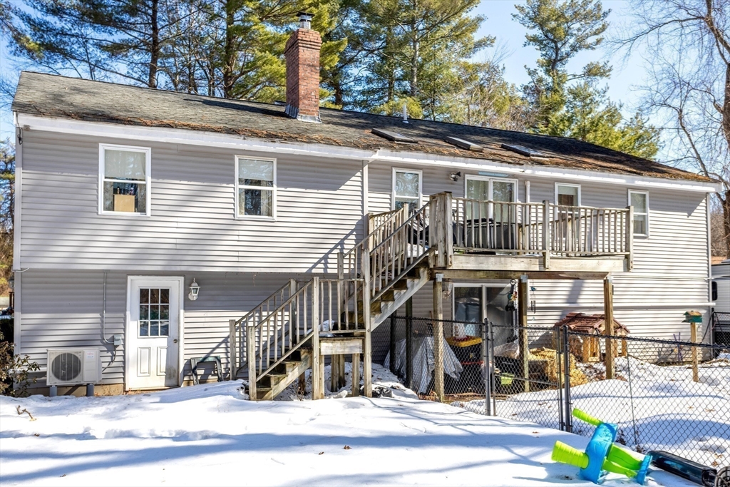 113 Parker Road, Unit 1 Lancaster, MA 01523 - Photo 28 of 30 a front view of a house with a tree