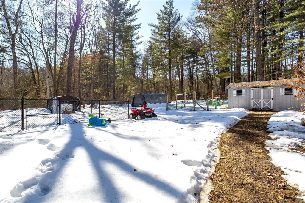 113 Parker Road, Unit 1 Lancaster, MA 01523 - Photo 29 of 30 a view of the patio with a fire pit