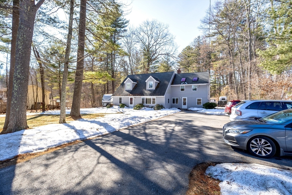 113 Parker Road, Unit 1 Lancaster, MA 01523 - Photo 30 of 30 a car parked in front of a house