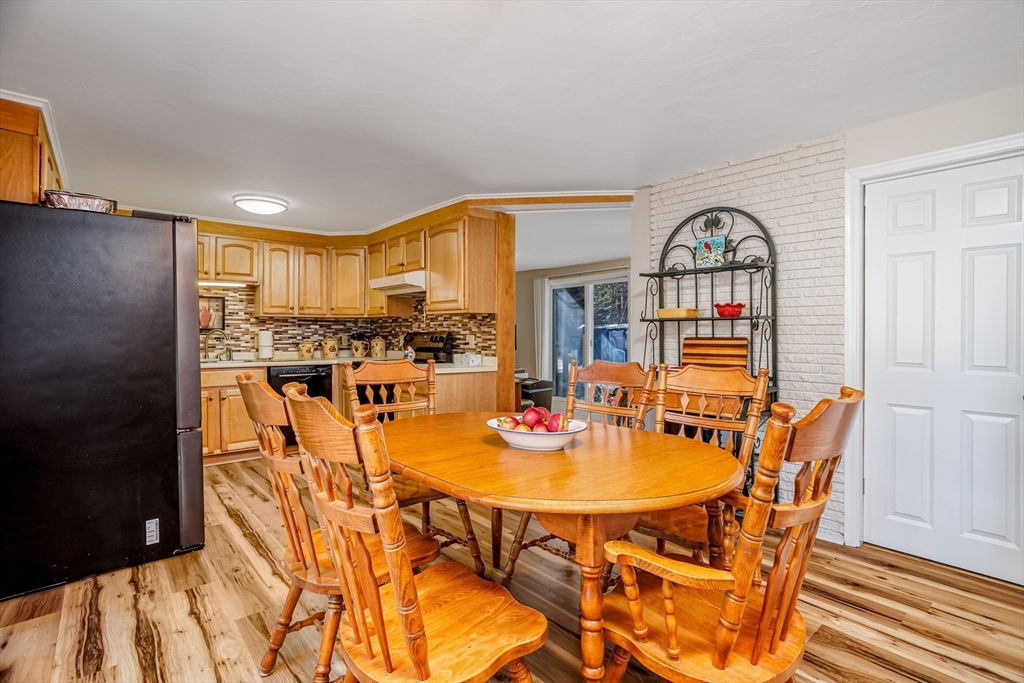 113 Parker Road, Unit 1 Lancaster, MA 01523 - Photo 10 of 30 a view of a dining room with furniture and a kitchen