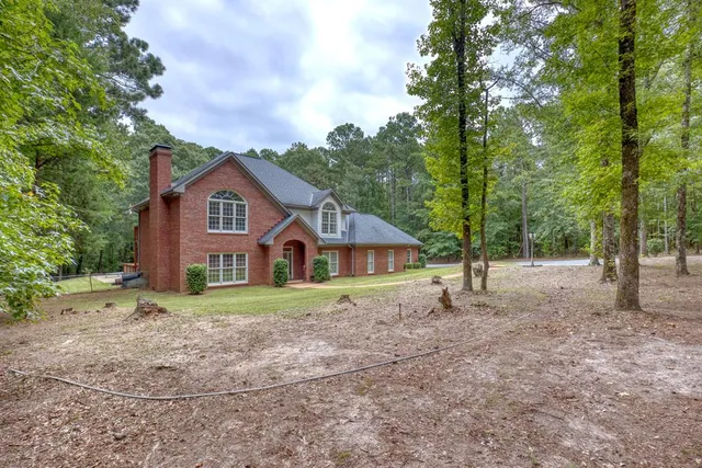 a house with trees in the background