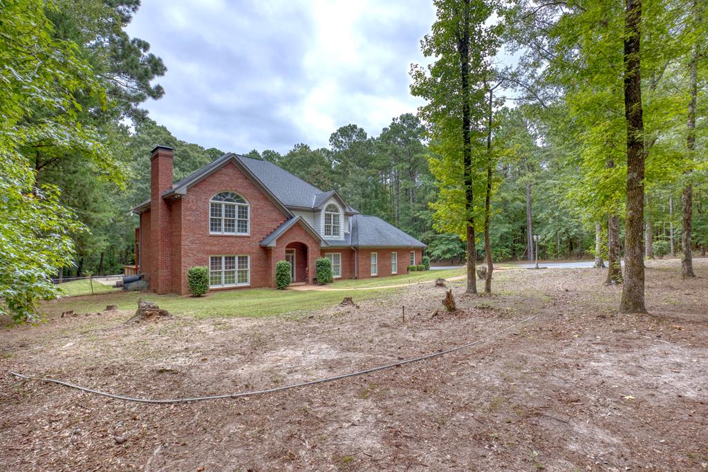 a house with trees in the background